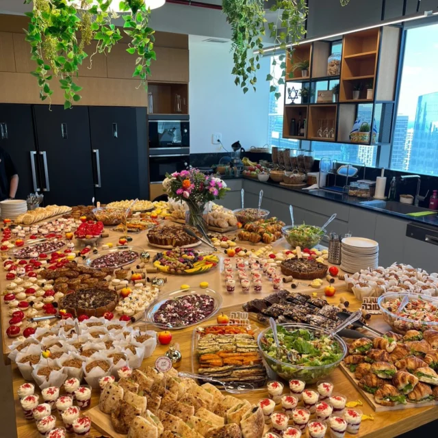 Our #AquaSecTeam in Tel Aviv is celebrating Rosh Hashanah at the office today with a festive toast and a table full of amazing food! 🍎🍯 Shana Tova from Aqua Security!